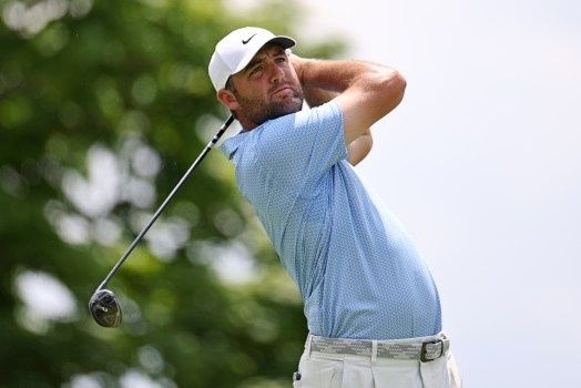 Golfer completing a drive, illustrating shot strategy in Stableford play